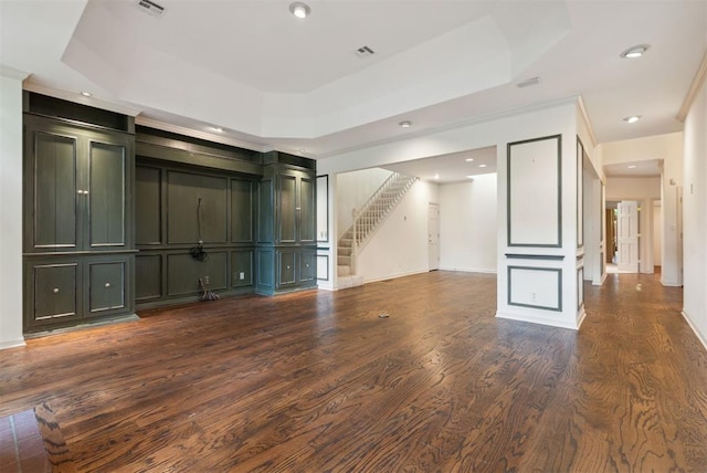 2825 NW Grand Blvd Unit 3, Oklahoma City, OK 73116 - unfurnished living room with stairs, dark wood-type flooring, ornamental molding, recessed lighting, and a decorative wall