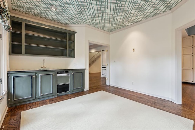 2825 NW Grand Blvd Unit 3, Oklahoma City, OK 73116 - kitchen featuring crown molding, open shelves, and dark wood-style floors