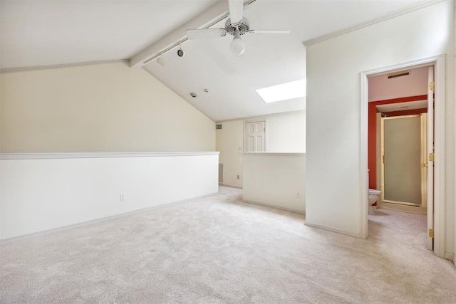 2825 NW Grand Blvd Unit 3, Oklahoma City, OK 73116 - unfurnished living room with a skylight, ceiling fan, and carpet floors