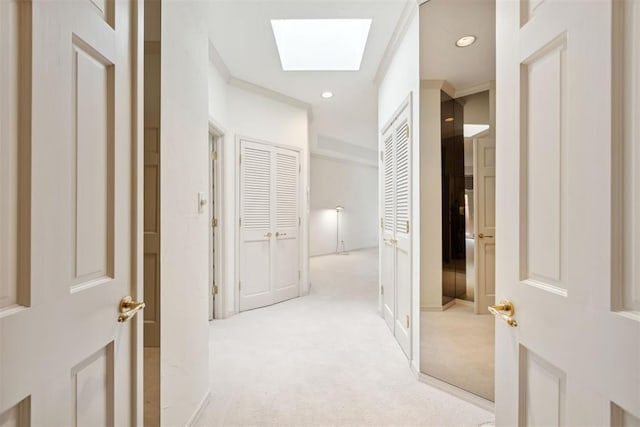 2825 NW Grand Blvd Unit 3, Oklahoma City, OK 73116 - corridor featuring light carpet, a skylight, recessed lighting, and ornamental molding