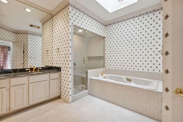 2825 NW Grand Blvd Unit 3, Oklahoma City, OK 73116 - full bathroom with vanity, a stall shower, a garden tub, a skylight, and wallpapered walls