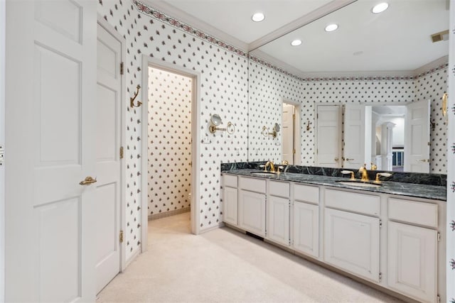 2825 NW Grand Blvd Unit 3, Oklahoma City, OK 73116 - bathroom featuring double vanity, recessed lighting, and wallpapered walls