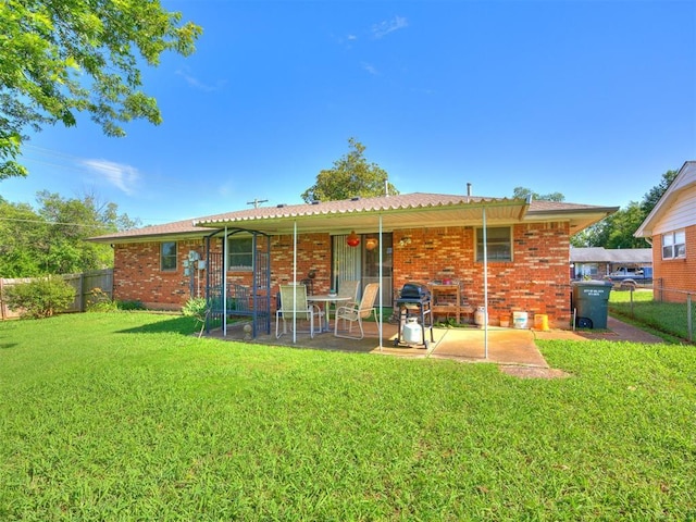 4021 E Larkwood Dr, Del City, OK 73115 - rear view of house with a fenced backyard, a patio, and brick siding