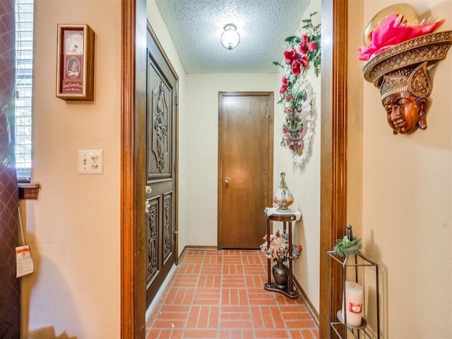 4021 E Larkwood Dr, Del City, OK 73115 - hallway with a textured ceiling and brick patterned flooring