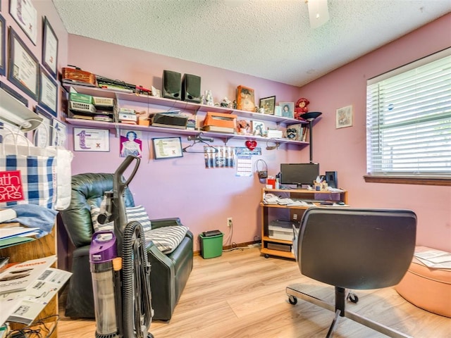 4021 E Larkwood Dr, Del City, OK 73115 - home office with light wood-style flooring and a textured ceiling
