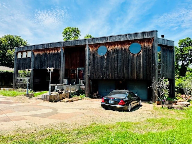 11413 Spring Creek Rd, Oklahoma City, OK 73162 - view of building exterior featuring a garage and driveway