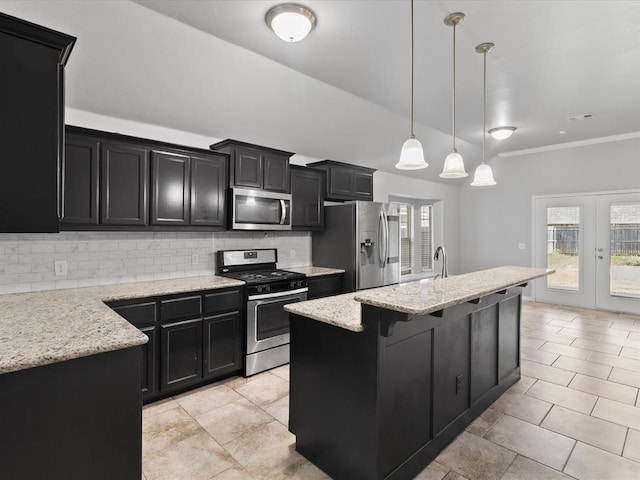 3325 NW 161st St, Edmond, OK 73013 - kitchen featuring stainless steel appliances, dark cabinetry, backsplash, french doors, and ornamental molding