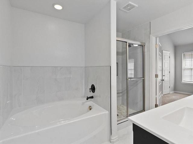 3325 NW 161st St, Edmond, OK 73013 - full bathroom with a garden tub, a stall shower, vanity, and recessed lighting