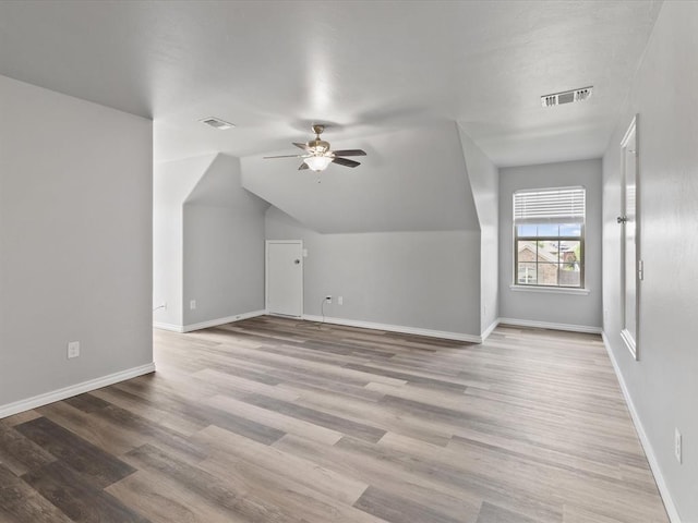 3325 NW 161st St, Edmond, OK 73013 - additional living space featuring a ceiling fan, wood finished floors, and lofted ceiling