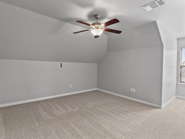 3325 NW 161st St, Edmond, OK 73013 - additional living space with light colored carpet, ceiling fan, and lofted ceiling