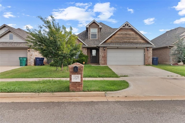 3325 NW 161st St, Edmond, OK 73013 - view of front of house with brick siding, concrete driveway, a front yard, a garage, and a shingled roof