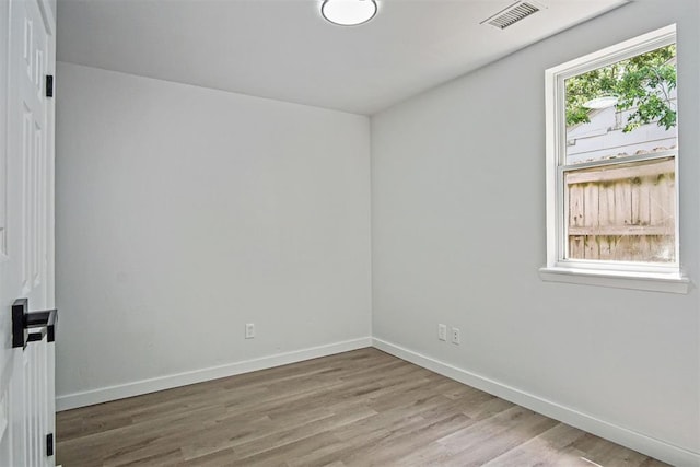 813 SW 56th St, Oklahoma City, OK 73109 - spare room with baseboards and wood finished floors