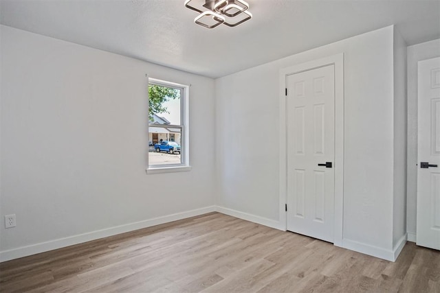 813 SW 56th St, Oklahoma City, OK 73109 - empty room featuring light wood finished floors and baseboards