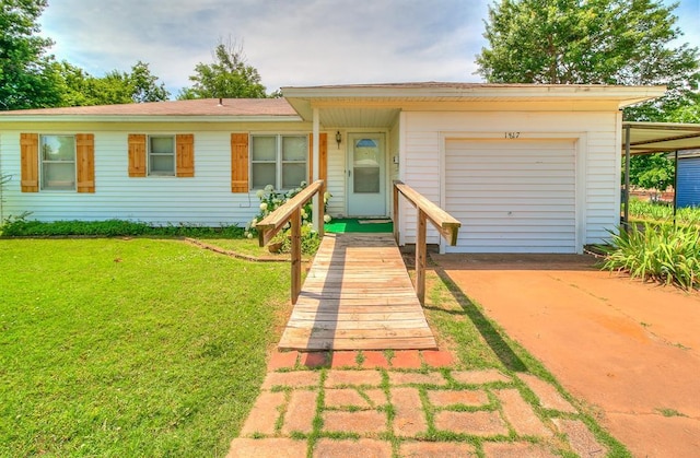 1817 W Harrison Ave, Guthrie, OK 73044 - ranch-style house with concrete driveway, a garage, and a front lawn