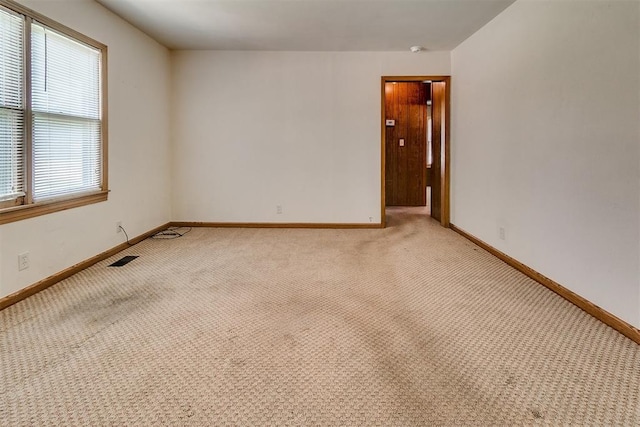 1817 W Harrison Ave, Guthrie, OK 73044 - unfurnished room with light colored carpet and baseboards