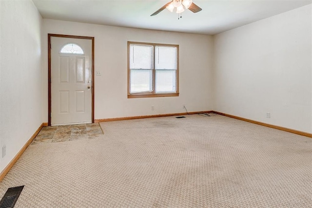 1817 W Harrison Ave, Guthrie, OK 73044 - entrance foyer featuring a ceiling fan, light colored carpet, and healthy amount of natural light