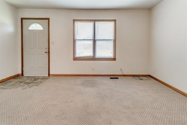 1817 W Harrison Ave, Guthrie, OK 73044 - entryway featuring light colored carpet and baseboards