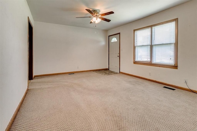 1817 W Harrison Ave, Guthrie, OK 73044 - empty room with ceiling fan and light carpet