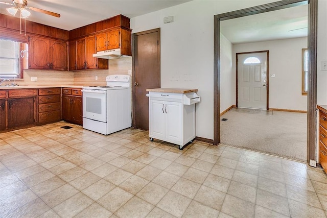 1817 W Harrison Ave, Guthrie, OK 73044 - kitchen with white electric stove, under cabinet range hood, light countertops, and ceiling fan