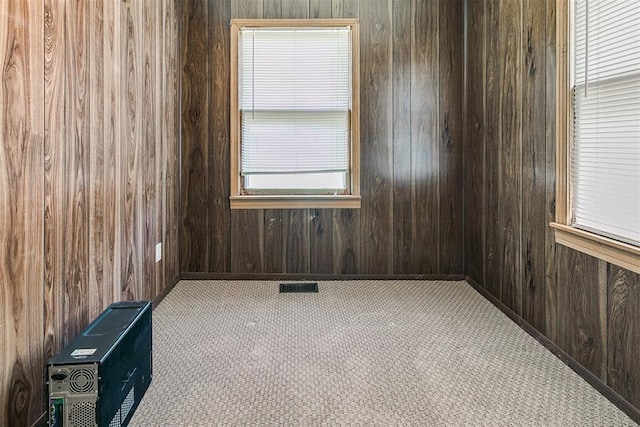 1817 W Harrison Ave, Guthrie, OK 73044 - carpeted spare room featuring wood walls