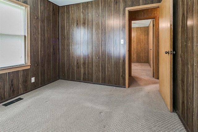 1817 W Harrison Ave, Guthrie, OK 73044 - carpeted spare room featuring wooden walls