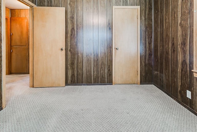 1817 W Harrison Ave, Guthrie, OK 73044 - unfurnished bedroom with carpet flooring and wooden walls