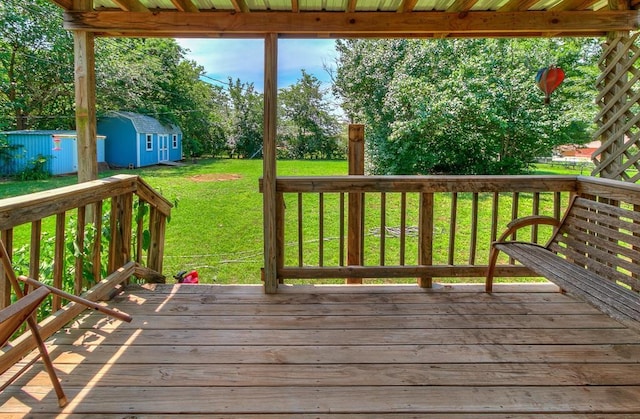 1817 W Harrison Ave, Guthrie, OK 73044 - wooden deck featuring a shed and a lawn