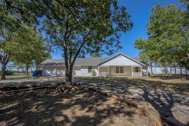 45350 Bob Crouch Rd, Tecumseh, OK 74873 - ranch-style house with a garage and a porch