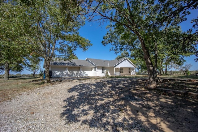 45350 Bob Crouch Rd, Tecumseh, OK 74873 - ranch-style house with a garage and driveway
