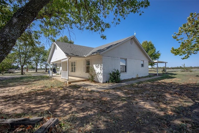 45350 Bob Crouch Rd, Tecumseh, OK 74873 - view of side of property featuring brick siding