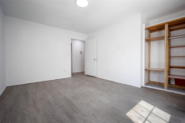 45350 Bob Crouch Rd, Tecumseh, OK 74873 - unfurnished bedroom with wood finished floors and baseboards