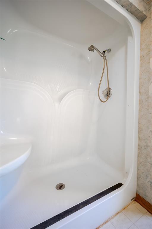 45350 Bob Crouch Rd, Tecumseh, OK 74873 - bathroom with tile patterned flooring and a shower