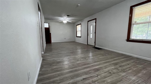 425 Mohawk Dr, Pauls Valley, OK 73075 - empty room featuring a ceiling fan and dark wood-type flooring