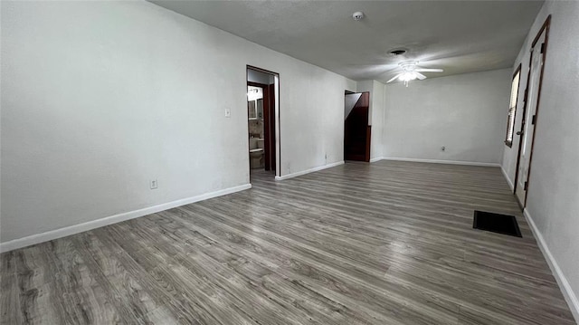 425 Mohawk Dr, Pauls Valley, OK 73075 - spare room with ceiling fan, wood finished floors, and a pendent fire sprinkler