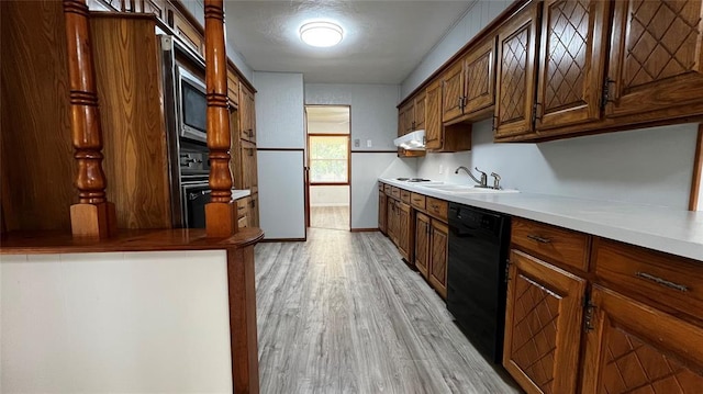 425 Mohawk Dr, Pauls Valley, OK 73075 - kitchen featuring dishwasher, light wood-style floors, ventilation hood, and stainless steel microwave