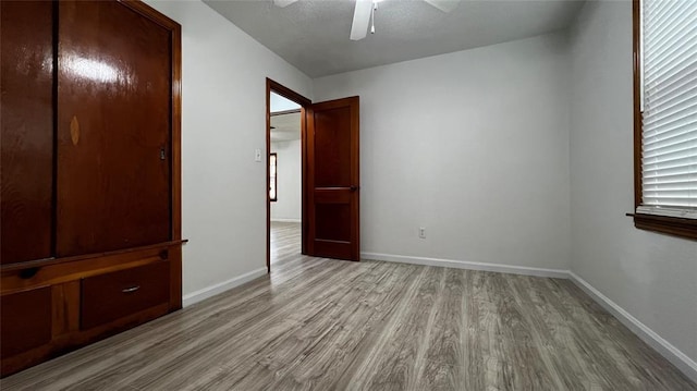 425 Mohawk Dr, Pauls Valley, OK 73075 - unfurnished bedroom with light wood finished floors and a ceiling fan