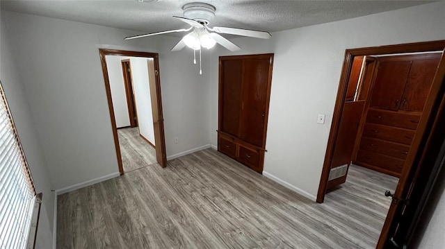 425 Mohawk Dr, Pauls Valley, OK 73075 - spare room featuring light wood finished floors, a ceiling fan, and a textured ceiling
