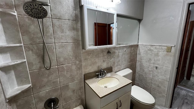 425 Mohawk Dr, Pauls Valley, OK 73075 - full bathroom featuring a shower, tile walls, and vanity
