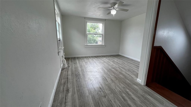 425 Mohawk Dr, Pauls Valley, OK 73075 - spare room featuring a ceiling fan, wood finished floors, and a textured wall