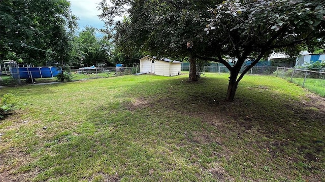 425 Mohawk Dr, Pauls Valley, OK 73075 - fenced backyard with a storage unit