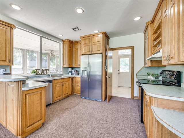 1124 Hill View Dr, Guthrie, OK 73044 - kitchen with appliances with stainless steel finishes, light colored carpet, plenty of natural light, light countertops, and recessed lighting
