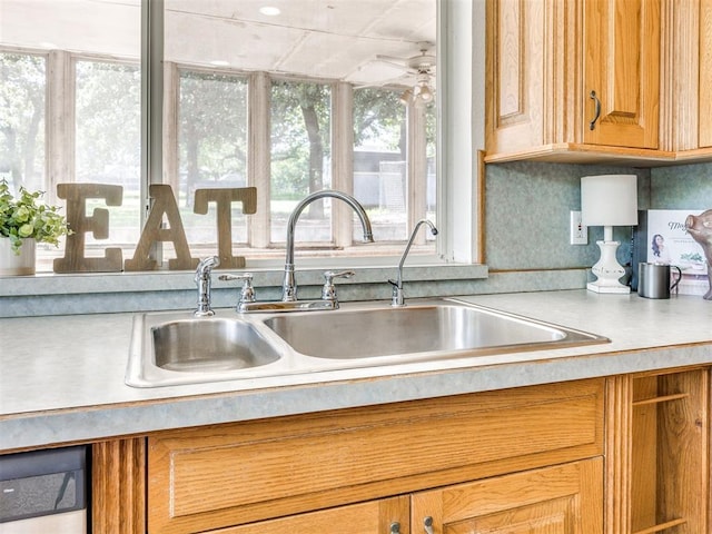 1124 Hill View Dr, Guthrie, OK 73044 - kitchen view of light countertops, dishwashing machine, and brown cabinets