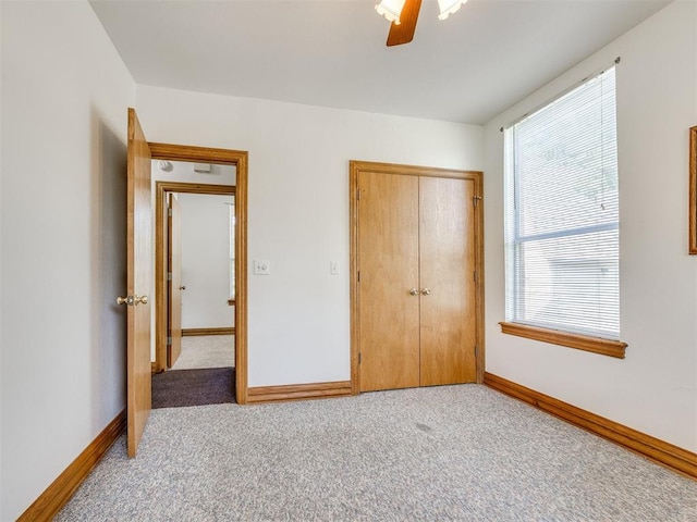 1124 Hill View Dr, Guthrie, OK 73044 - unfurnished bedroom with multiple windows, a closet, and carpet floors
