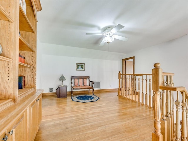 1124 Hill View Dr, Guthrie, OK 73044 - living area with an upstairs landing, light wood finished floors, and ceiling fan