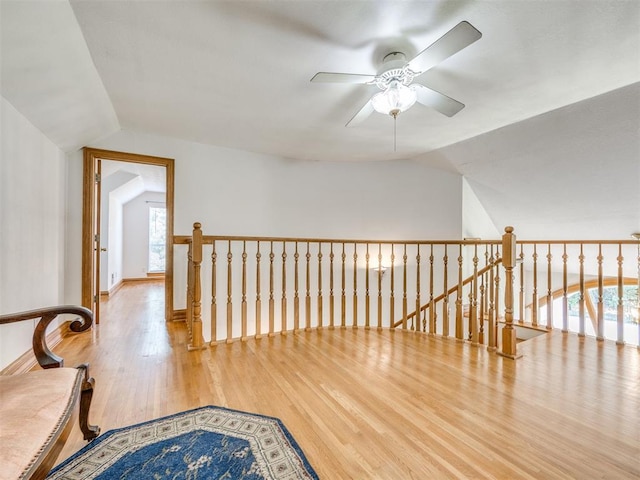1124 Hill View Dr, Guthrie, OK 73044 - hallway with lofted ceiling, an upstairs landing, and wood finished floors