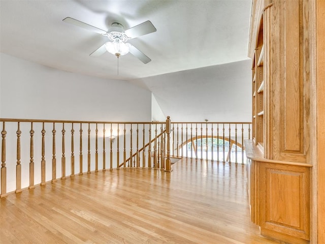 1124 Hill View Dr, Guthrie, OK 73044 - spare room with wood finished floors, a ceiling fan, and lofted ceiling