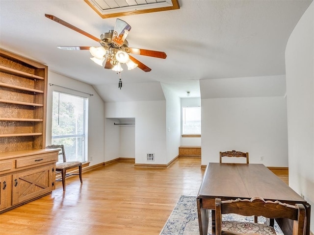 1124 Hill View Dr, Guthrie, OK 73044 - dining room featuring a ceiling fan, light wood finished floors, and lofted ceiling