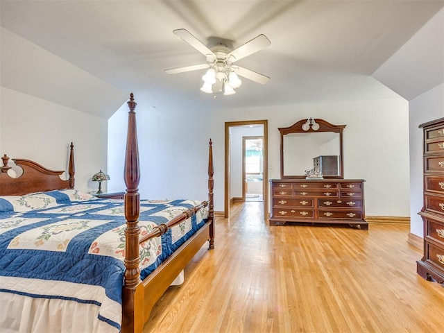 1124 Hill View Dr, Guthrie, OK 73044 - bedroom with light wood finished floors, vaulted ceiling, and ceiling fan