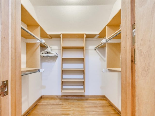 1124 Hill View Dr, Guthrie, OK 73044 - spacious closet featuring wood finished floors