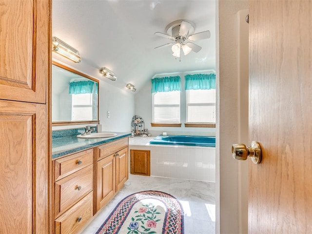 1124 Hill View Dr, Guthrie, OK 73044 - bathroom featuring vanity, vaulted ceiling, a garden tub, and a ceiling fan